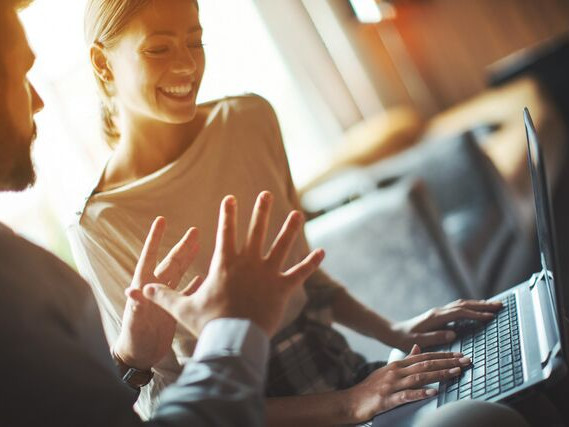 Small Man and woman behind computer 1