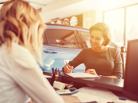 Small Women in car dealership 4